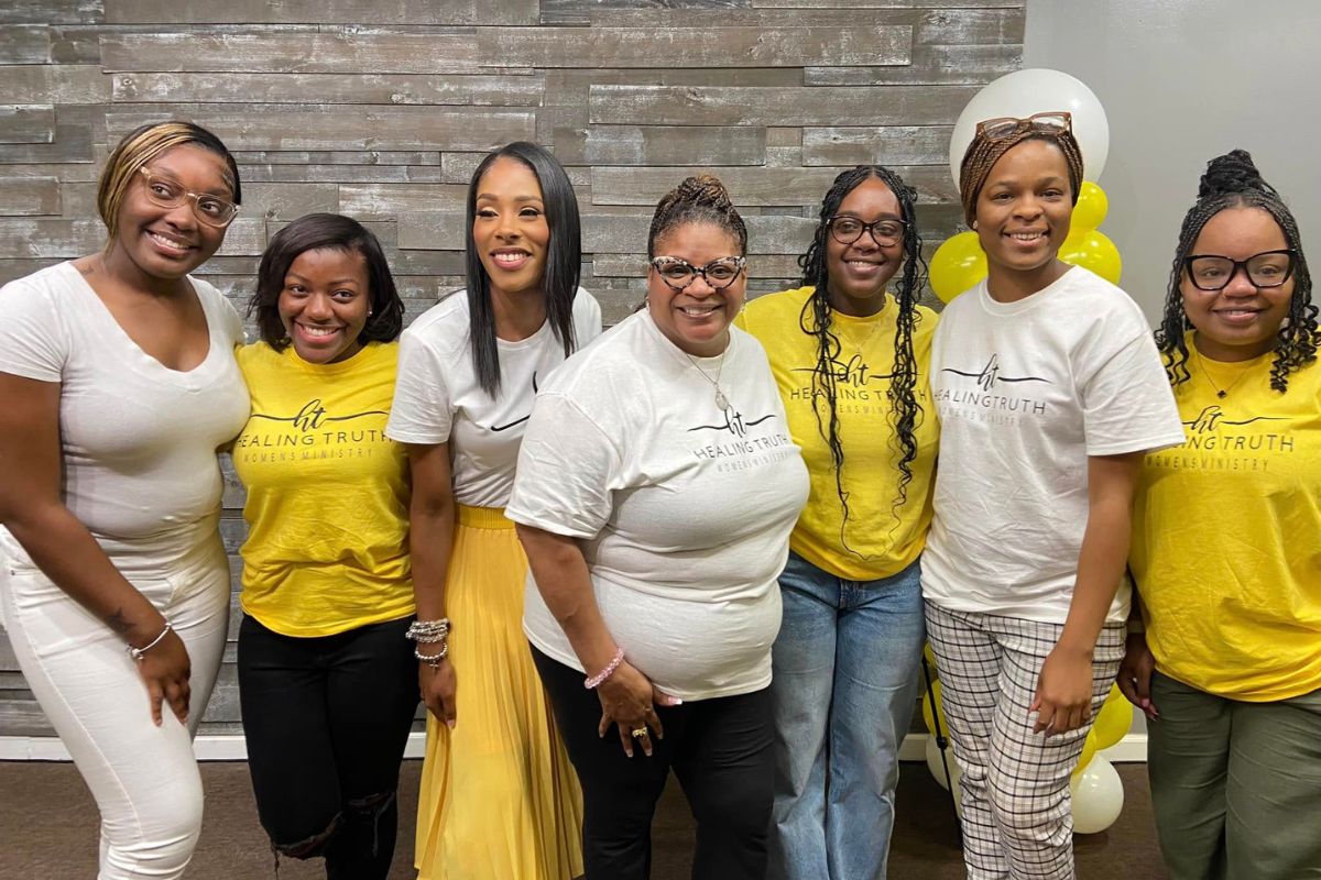 Women gathered in a supportive setting